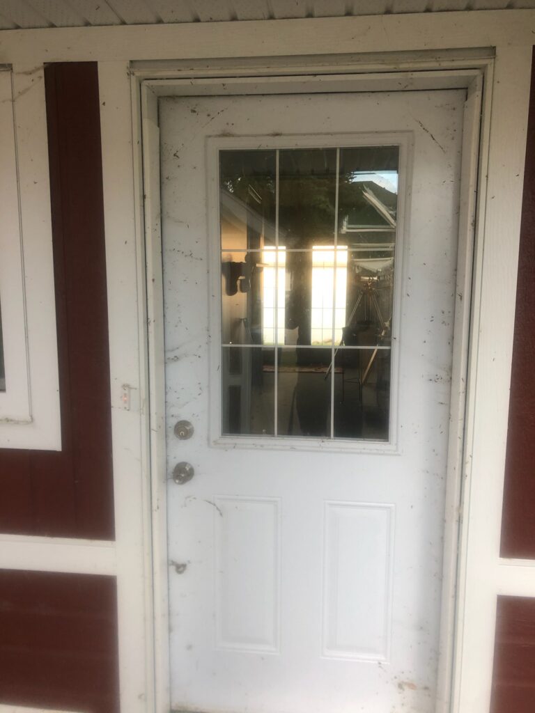 Cleaned dust and spiders off of the door in Sylvan Lake power washing services